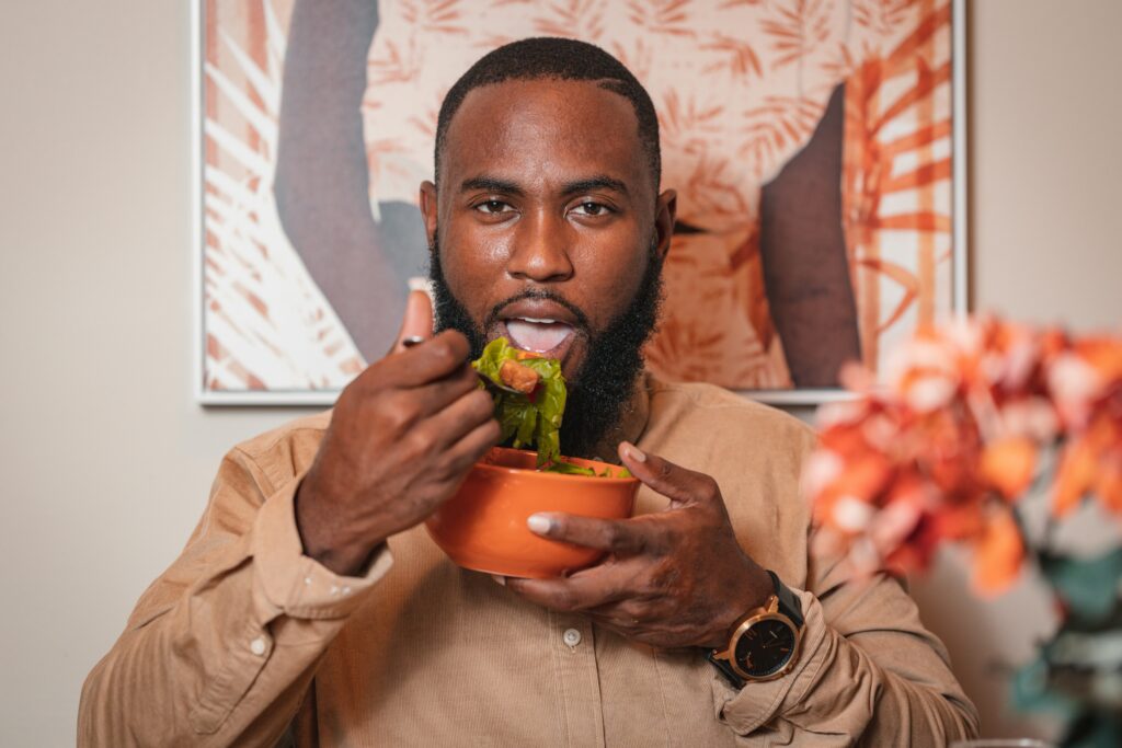 man eating salad healthy eating on vacation