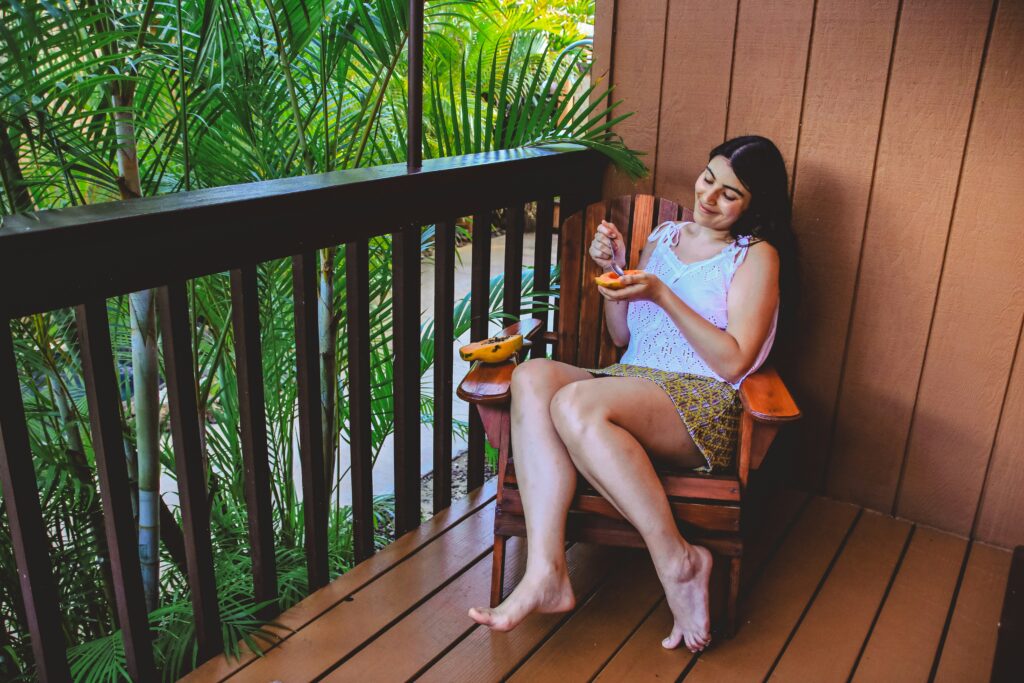 woman eaitng fruit on vacation healthy food healthy eating on vacation