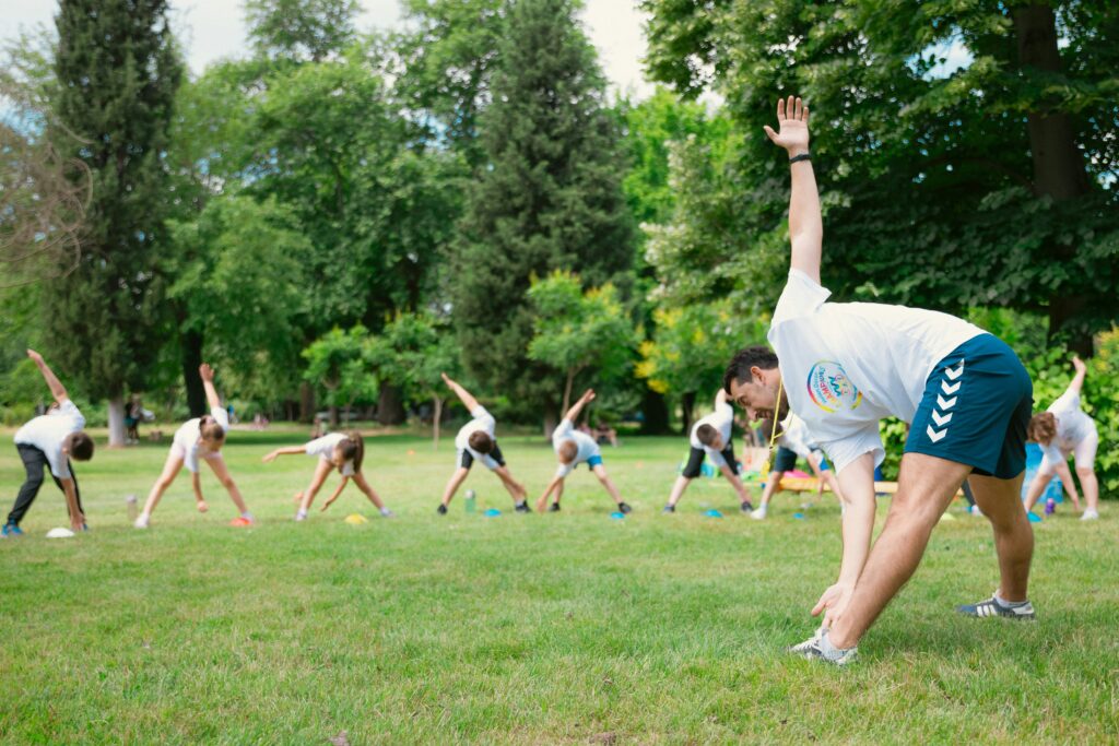 stretching yoga outdoor fitness class working out how to exercise in summer heat