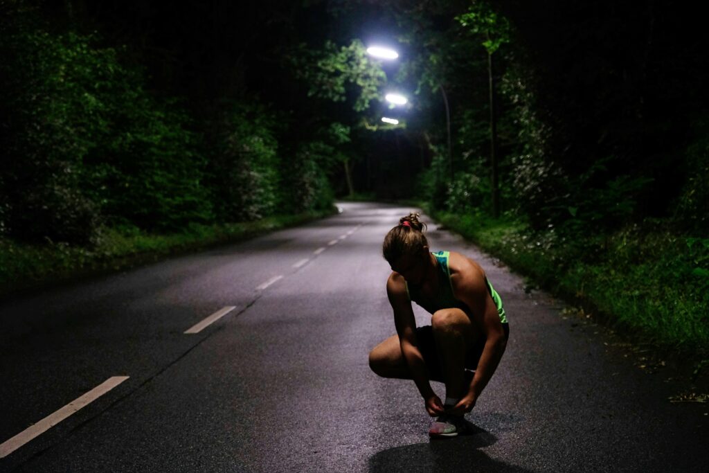woman running outside at night how to exercise in summer heat