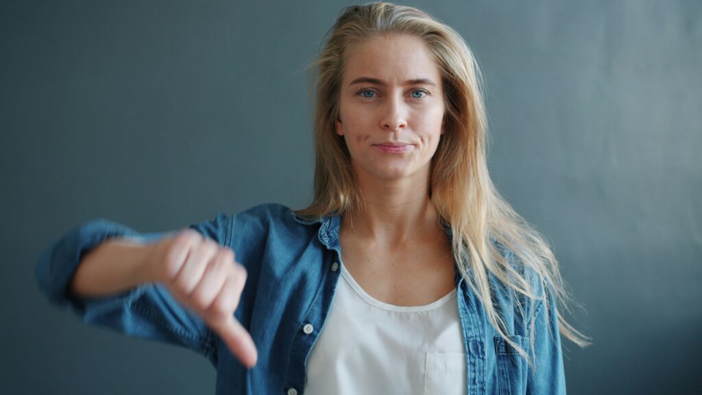 signs of trauma bonding woman disapproval no bad rejection thumbs down
