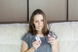 What is the best Magnesium to take - woman holding pills