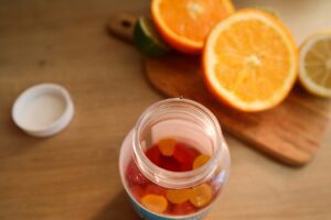 woman holding vitamins - what is the best magnesium to take