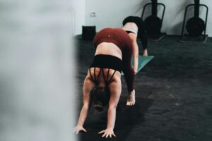 lady stretching - what is hot yoga