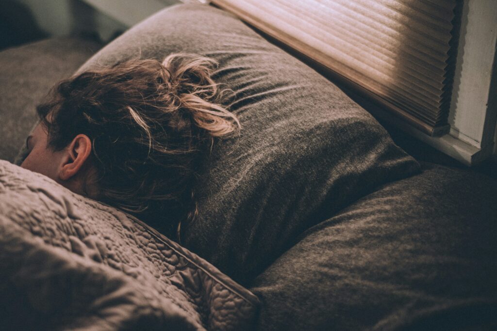 Melatonin for Kids - sleepy tired sleeping fatigue woman sleeping on bed