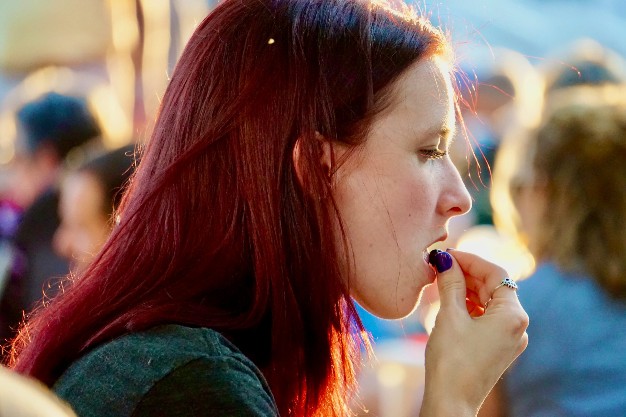 person taking vitamins elderberry gummies
