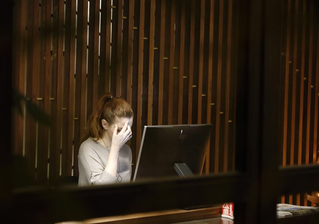 burnout stressed out tired upset exhausted woman at work post tax season burnout