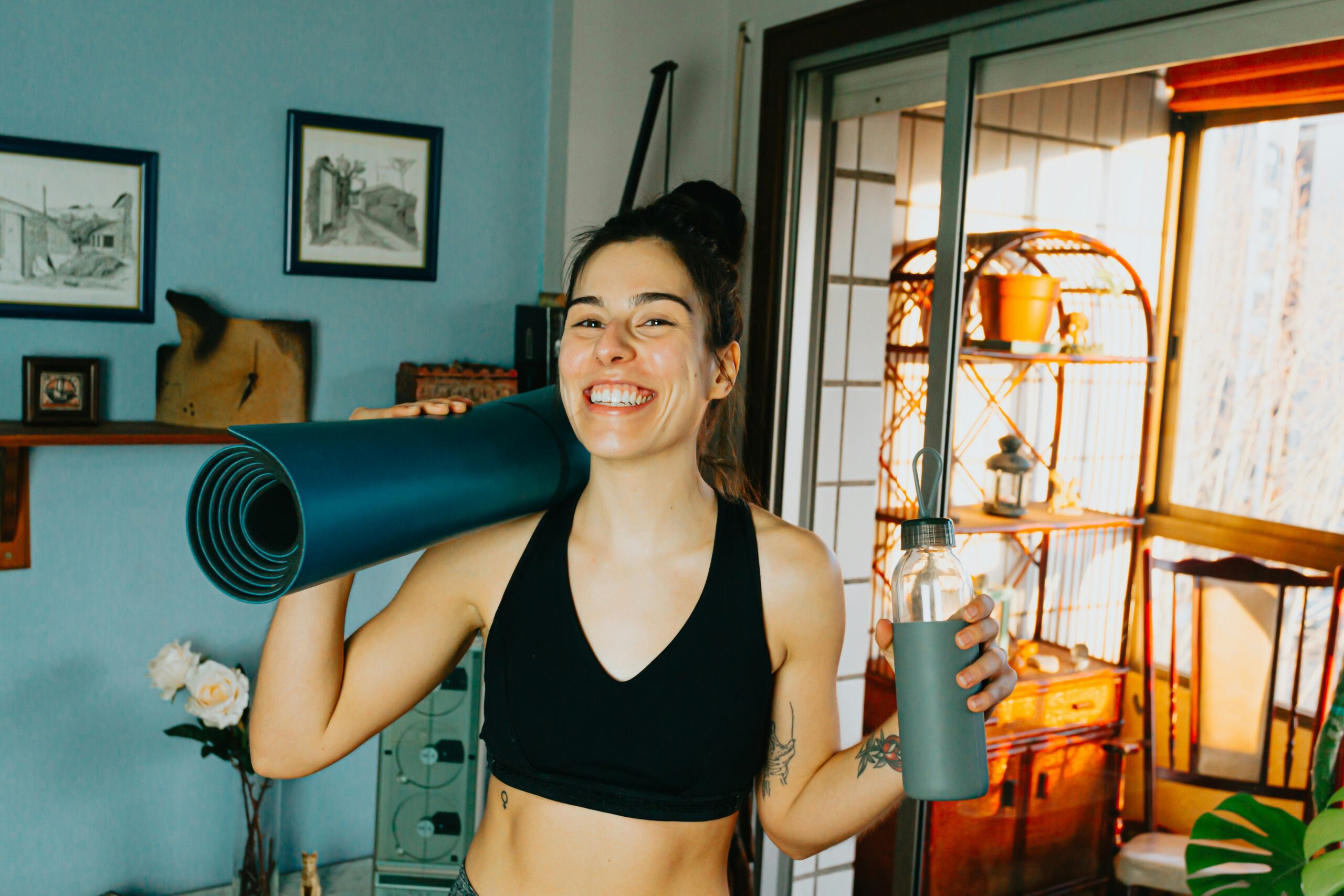woman excerise working out with a yoga mat weekly workout schedule