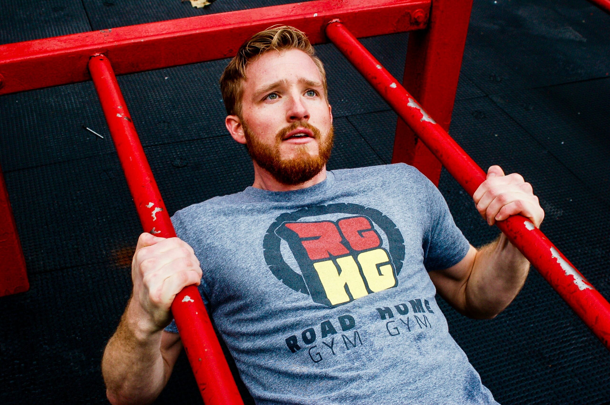 man at the gym working out weekly workout schedule