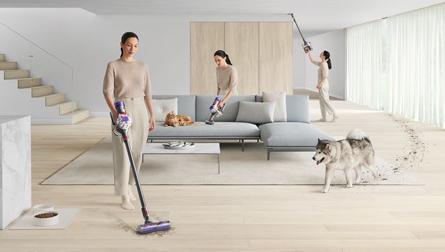 woman using a dyson vacuum 