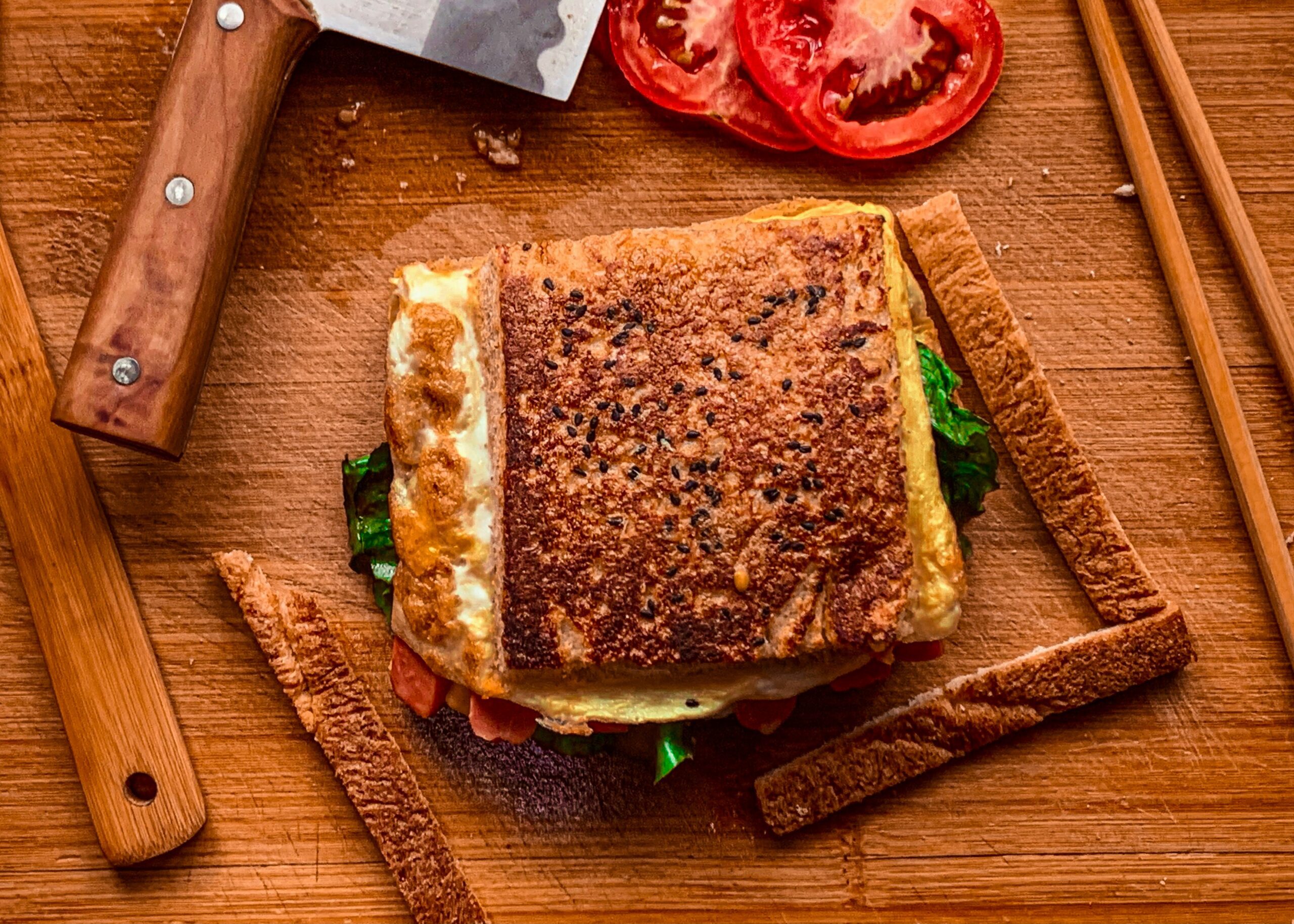 sadnwich Photo by <a href="https://unsplash.com/@ra1n?utm_source=unsplash&utm_medium=referral&utm_content=creditCopyText">John Eric</a> on <a href="https://unsplash.com/photos/a-sandwich-on-a-cutting-board-with-a-knife-and-tomatoes-RPB9NkM5xe8?utm_source=unsplash&utm_medium=referral&utm_content=creditCopyText">Unsplash</a> 