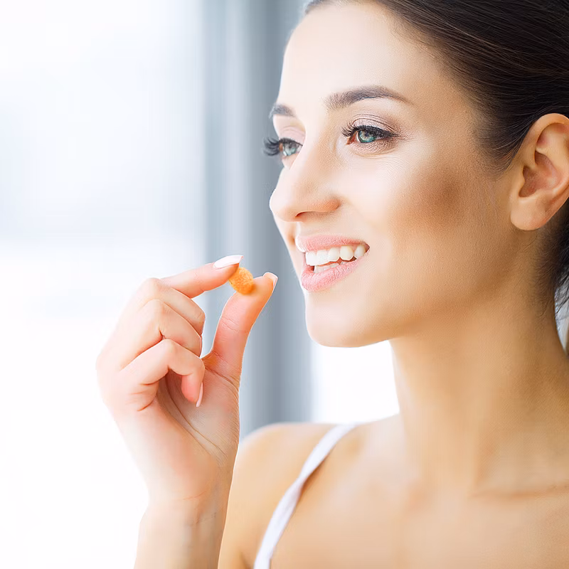 woman taking vitamins