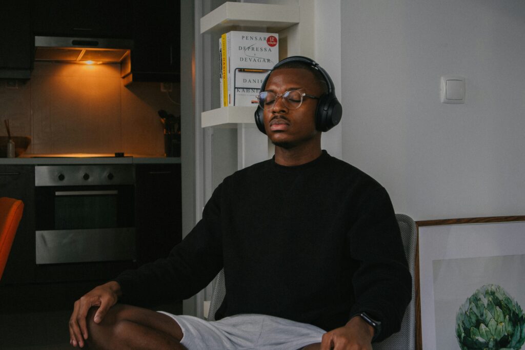 man listening to music on headphones meditation meditatingbest meditation apps