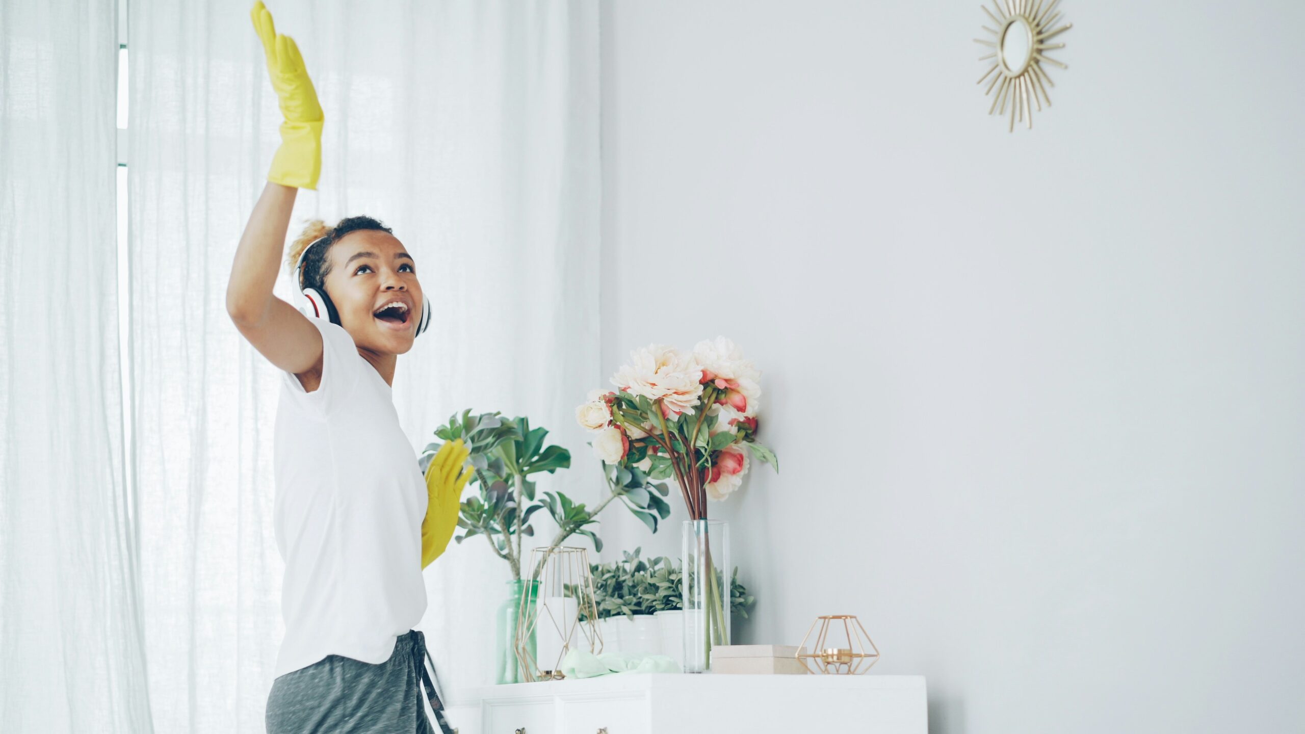 reduce toxins at home woman cleaning home how to calm the sunday scaries