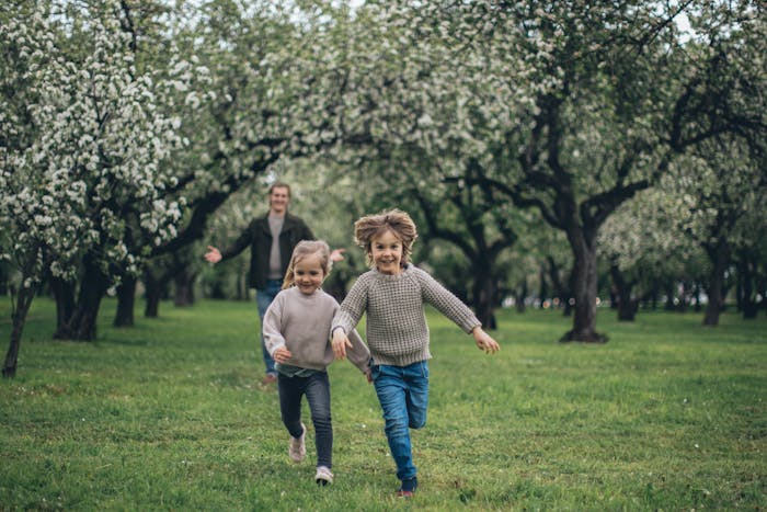 balanced life featured image kids running ahead of dad