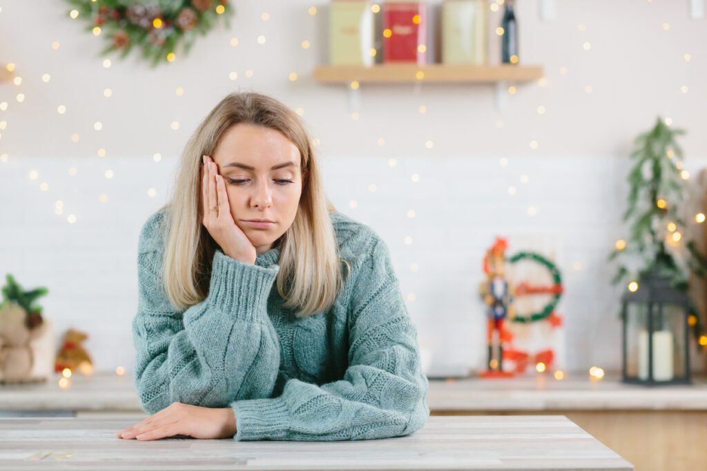 holiday stress relief A young beautiful woman was left alone at home for the New Year and Christmas holidays holiday stress for couples