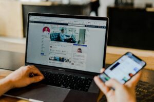 social media addiction - person on facebook on computer