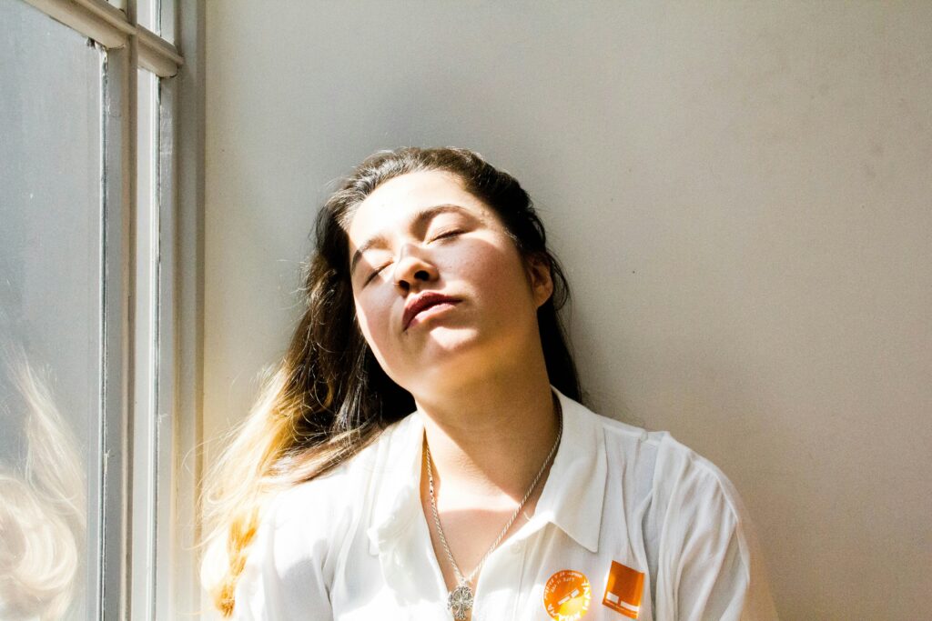 chronic fatigue solutions - woman at window