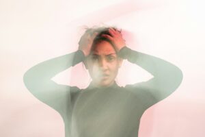 invisible anxiety - woman holding her head
