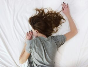 chronic fatigue solutions - woman sleeping - invisible anxiety