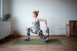  What happens if you don't stretch after a workout - woman doing yoga