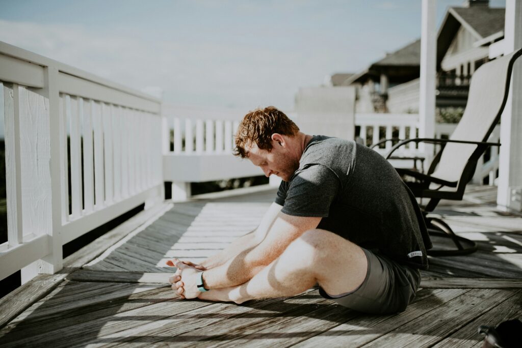 soft movement workout routine for better energy What happens if you don't stretch after a workout - man doing yoga stretches how to calm the sunday scaries