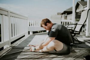  What happens if you don't stretch after a workout - man doing yoga stretches