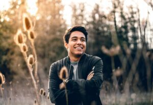 Toxic Positivity - smiling man in field