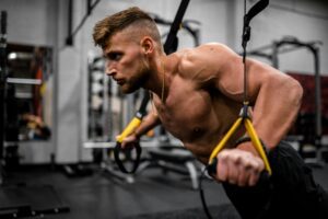 supplements for muscle - guy at gym