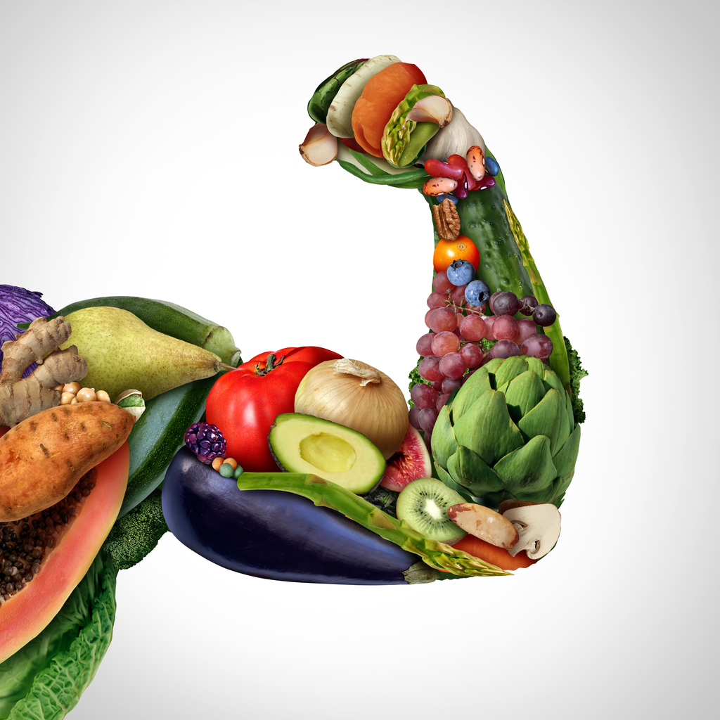Fruit And Vegetables Power as a symbol of the powerful nutrition with natural minerals and vitamins from fresh produce as a concept for vegan and vegetarian fitness and dietary detox, superfoods for energy - muscle building