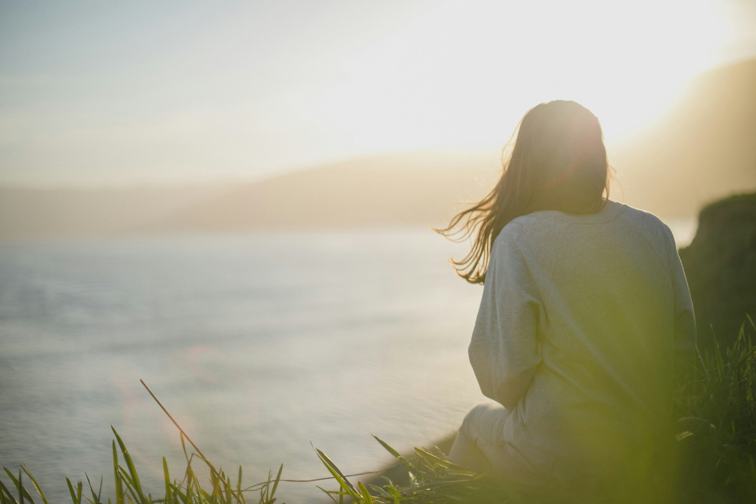 woman sitting outside slow wellness