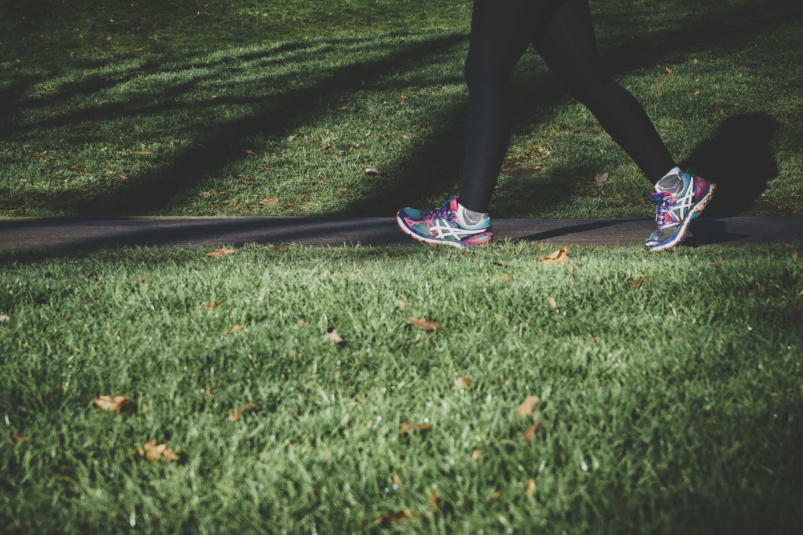 person walking outdoors running shoes
