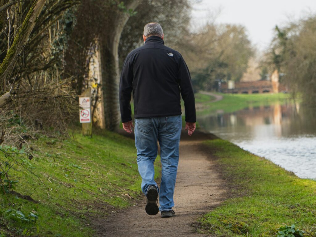 man walking outdoors walking routine beginners over 50