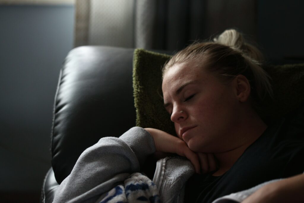 woman sleepy tired taking a nap exhausted signs of burnout